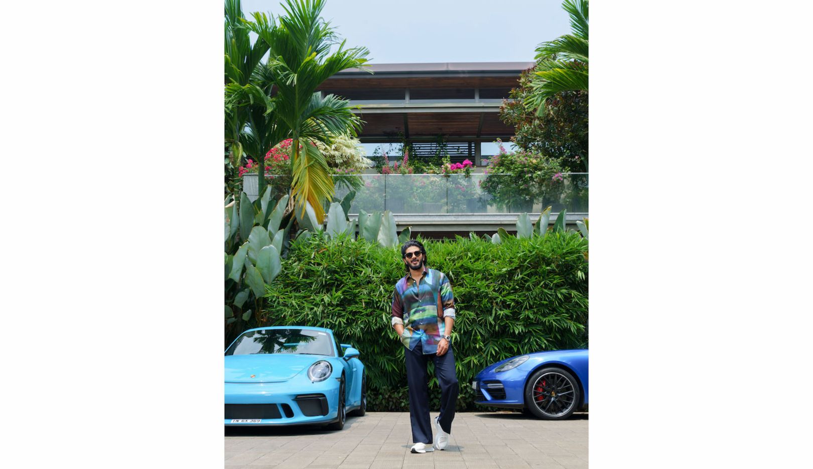 All around the house, the picture is dominated by native plants – and Salmaan’s Porsche sports cars. 