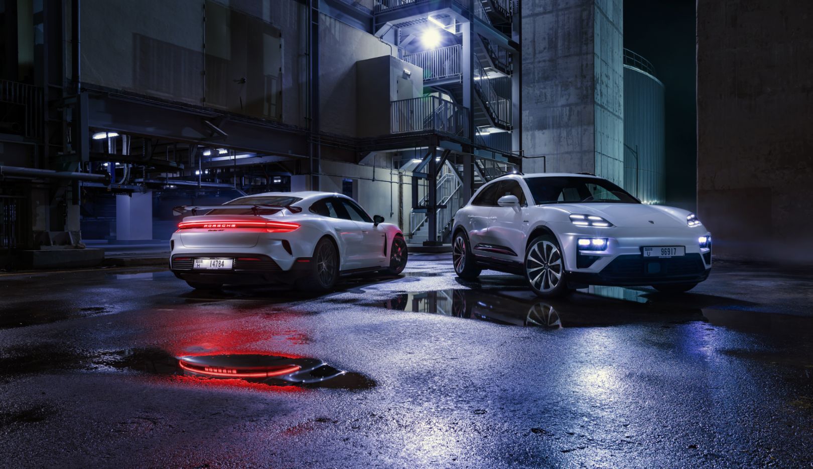 Star of the show: The two electric sports cars at the edge of the solar park – the setting looks like something out of a Hollywood film.