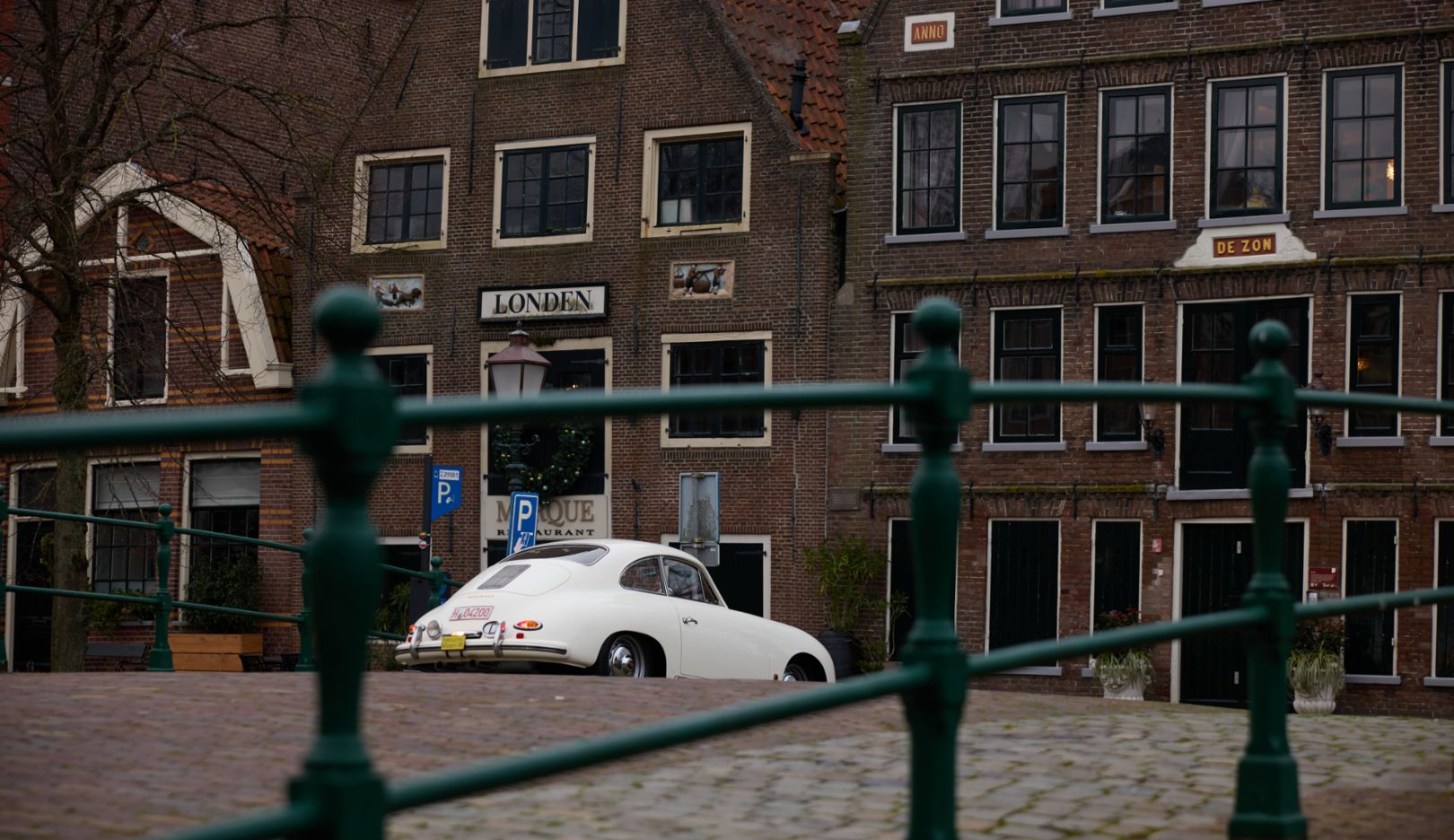 The classic car cuts a good figure against the historic architecture in Hoorn.