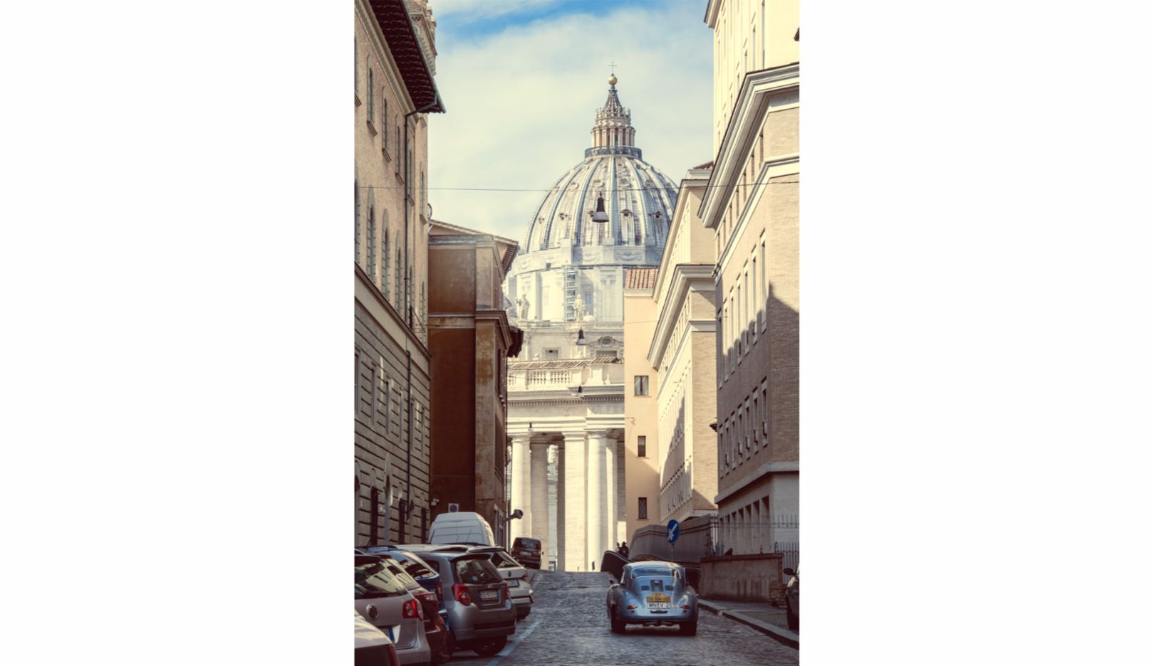Marc Lieb reverentially guides the V2 towards St. Peter’s Basilica. The narrow lane becomes the perfect resonator for the engine sound. 