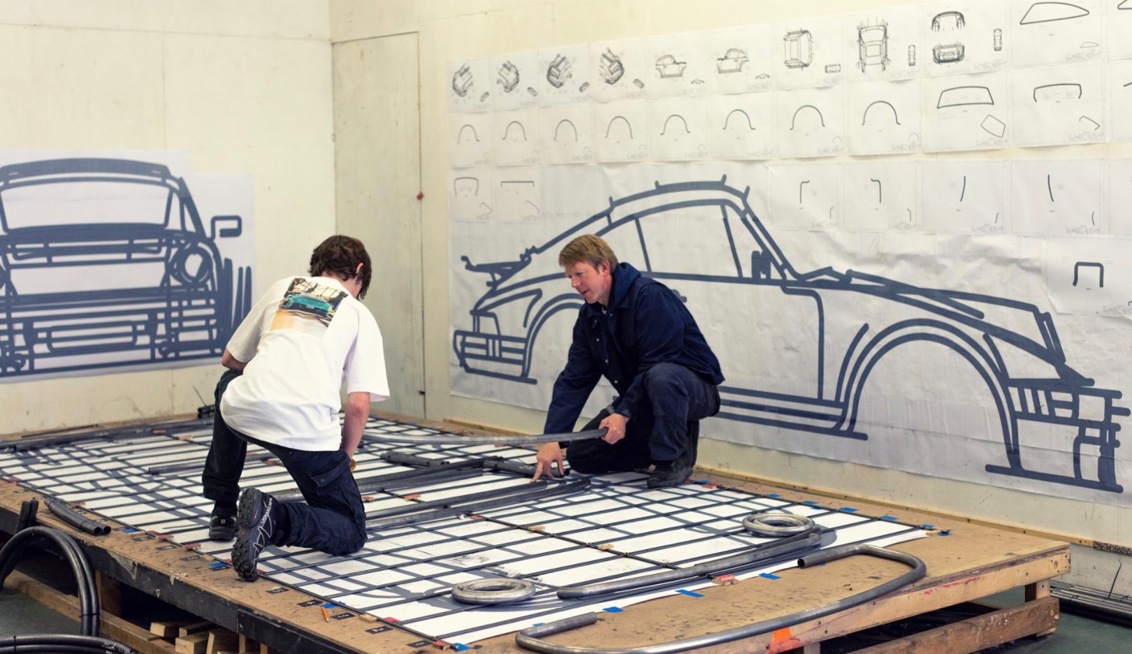 911 Love: Benedict Radcliffe works on his latest creation, a Porsche 934 in 1:1 scale, with assistant Jordan Wilkes-Siddeley at his studio in Shoreditch, East London.