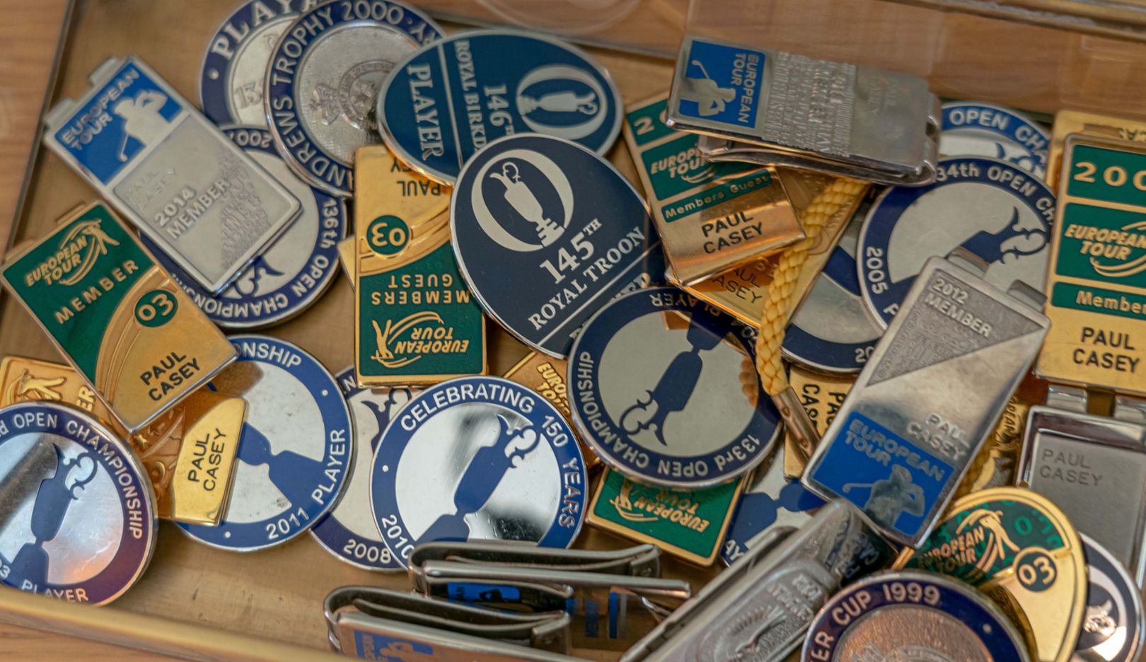 Each badge holds a memory: “I was tough as nails to myself and to others.”