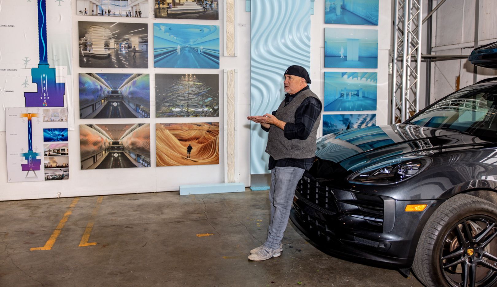 Studio parking space: Gordon Huether with his Porsche Macan S in front of photographs of his works in Napa, California, USA.